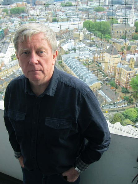 Colin O’Brien on the balcony of the flat in Clerkenwell, which he moved into with his parents when it was built in 1966.