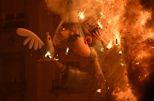Cardboard figurines burn on the last night of the Fallas festival in Valencia