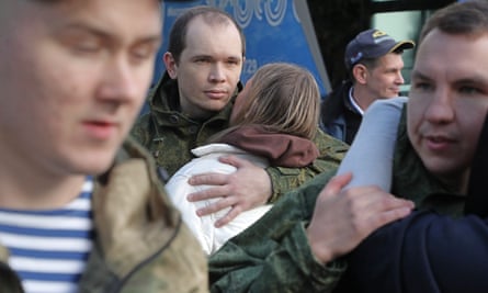 On Wednesday, conscripts bid farewell to their loved ones at a recruiting office in Moscow.