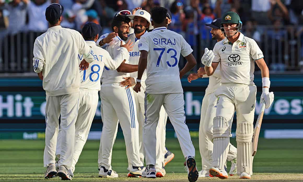 Marnus Labuschagne (right) leaves the field after losing his wicket to Jasprit Bumrah on the third day of the first Test between Australia and India.