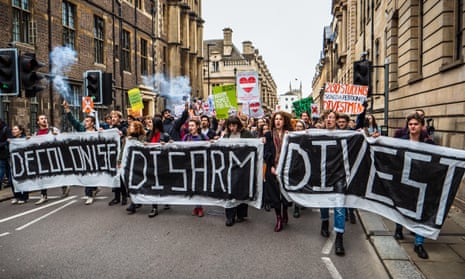 Cambridge University students marched in November 2018 demanding the university divest from arms and fossil fuel.