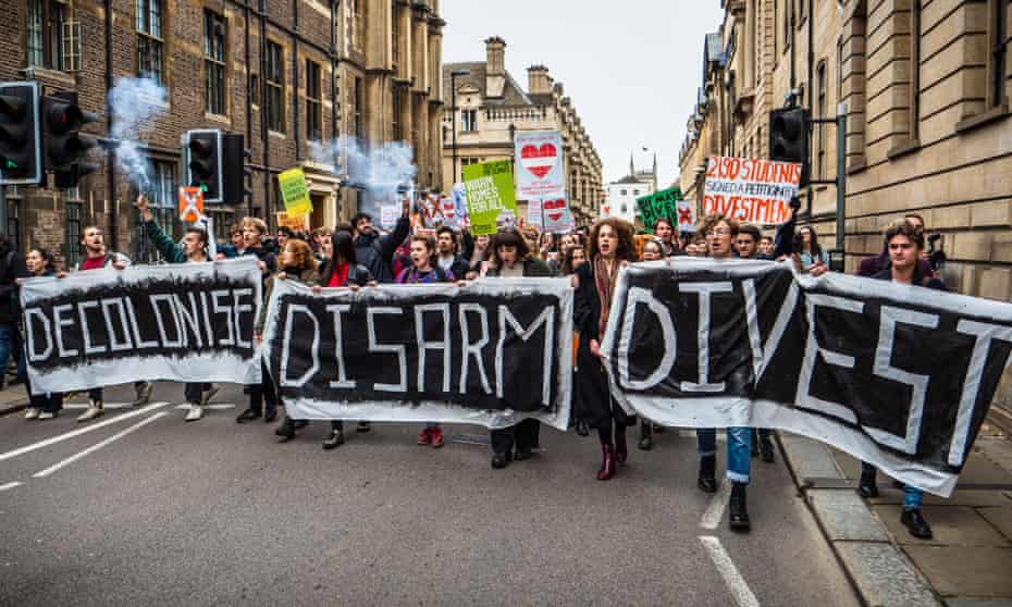 Cambridge University students march in Cambridge.