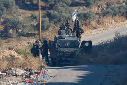 Israeli soldiers in vehicle in West Bank