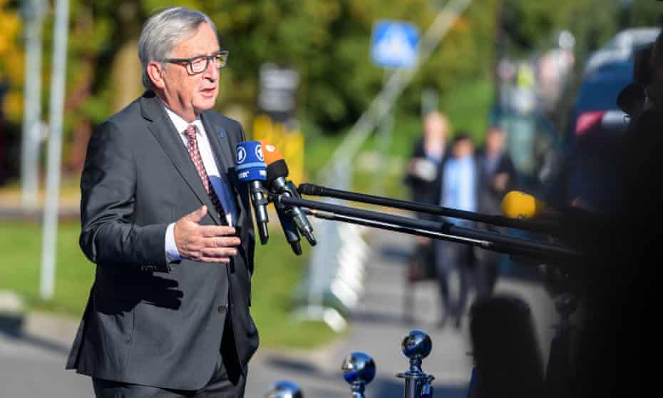 Jean-Claude Juncker talks to journalists as he arrives for a summit in Tallinn, Estonia, on Friday.
