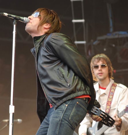 Liam Gallagher and Andy Bell on stage at an Oasis concert in 2007.