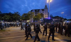 Riot police officers attend an anti-G20 protest in Schanzenviertel before the summit in Hamburg