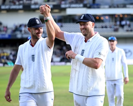 Josh Tongue and Ollie Robinson of England leave the field after taking five wickets each during day one of the 1st Rothesay Test Match between England and Pakistan at Headingley