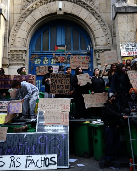 High school students gather outside the Lycee Voltaire high school.