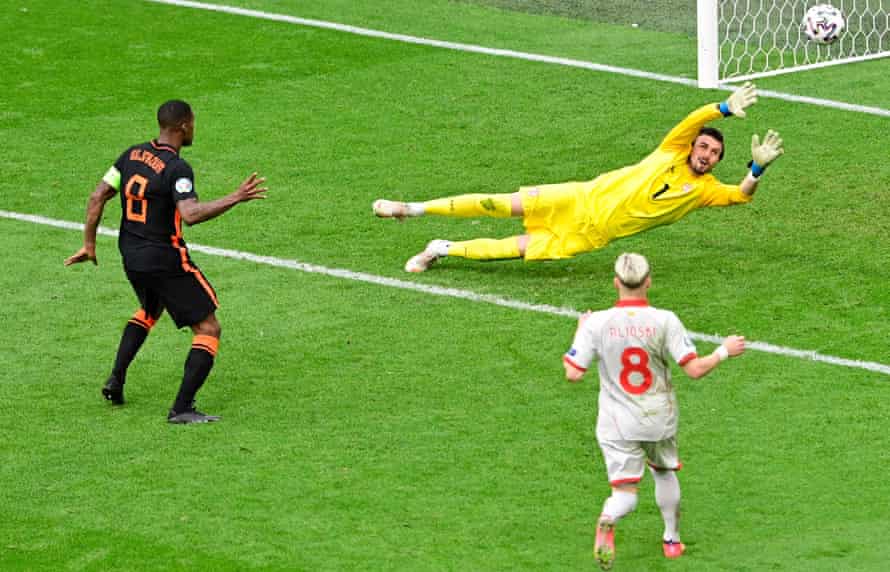 Georginio Wijnaldum scores the Netherlands' third goal against North Macedonia.