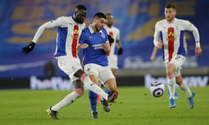 Cheikhou Kouyate of Crystal Palace and Neal Maupay of Brighton & Hove Albion.