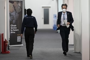 Luxembourg negotiator Andrew Ferrone runs inside the conference venue