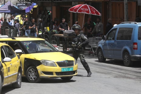 Israeli security forces in Bab al-Zawiya, Hebron, in the occupied West Bank on 25 April.