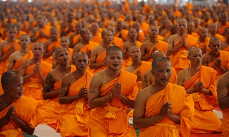 Thai buddhist monks praying