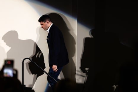 State Representative James Talarico descends steps, lit dramatically against a shadowed wall