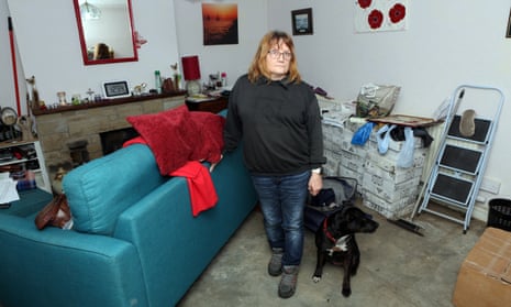 Barbara Campion and her dog, Roxy, in living room