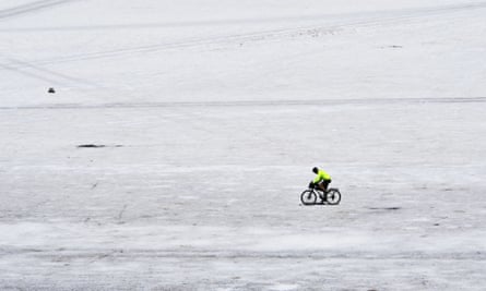 A man cycles at the Uyuni salt flat in Uyuni, Bolivia, in October 2022.
