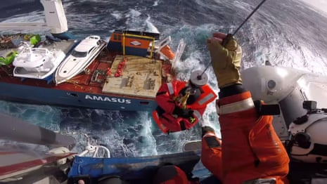 Cargo ship crew in dramatic rescue after vessel loses power in rough seas off Norway – video