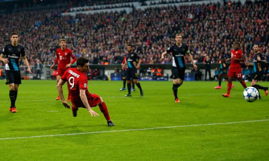 Robert Lewandowski scores for Bayern Munich against Arsenal in November 2015.