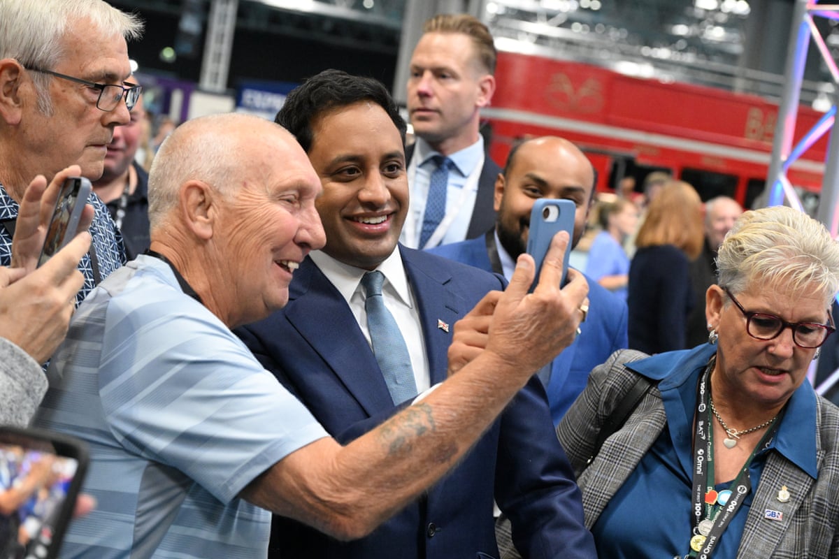 Zia Yusuf taking a selfie with supporters.