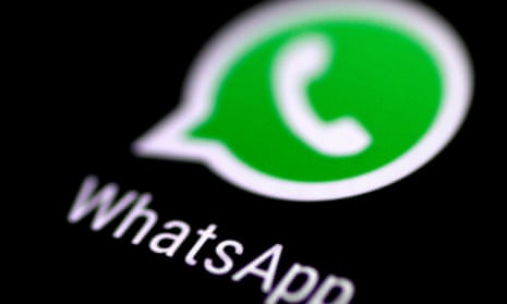 WhatsApp messaging app is seen on a phone screen