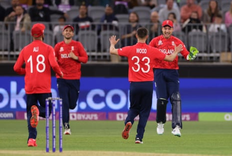 England bowler Mark Wood reacts with wicket keeper Jos Buttler (right) after the dismissal of Afghanistan batsman Mohammad Nabi.