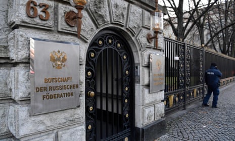 A police officer stands in front of the Russian embassy in Berlin.