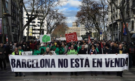 Protesters carry a banner that reads ‘Barcelona is not for sale’ during a demonstration in La Rambla.