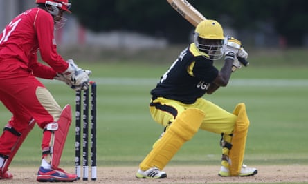 Frank Nsubuga plays a shot