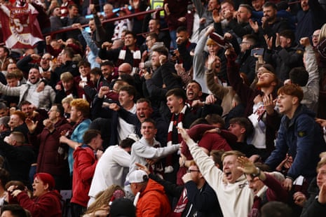 Heart of Midlothian fans celebrate after Cameron Devlin scores their second goal