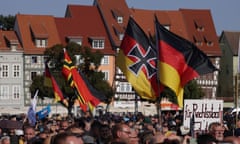 Alternative for Germany (AfD) Campaigns In Erfurt Day Before State Elections<br>ERFURT, GERMANY - AUGUST 31: Supporters of the far-right Alternative for Germany (AfD) political party wave German flags, including one adorned with an Iron Cross, at the final AfD campaign rally ahead of tomorrow's Thuringia state elections on August 31, 2024 in Erfurt, Germany. The AfD is currently leading in polls in Thuringia and is in a tight second place in Saxony ahead of state elections scheduled for Sunday in both states. (Photo by Sean Gallup/Getty Images)