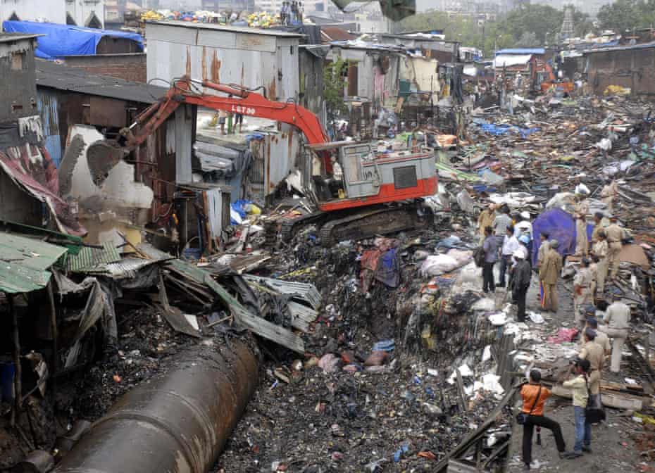 Illegal homes near the water pipeline are demolished in Dharavi.