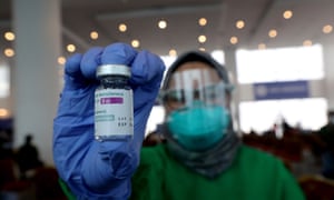 A health worker shows a vial of AstraZeneca vaccine during a Covid-19 vaccination drive at a shopping mall in Jakarta, Indonesia, 08 June 2021.