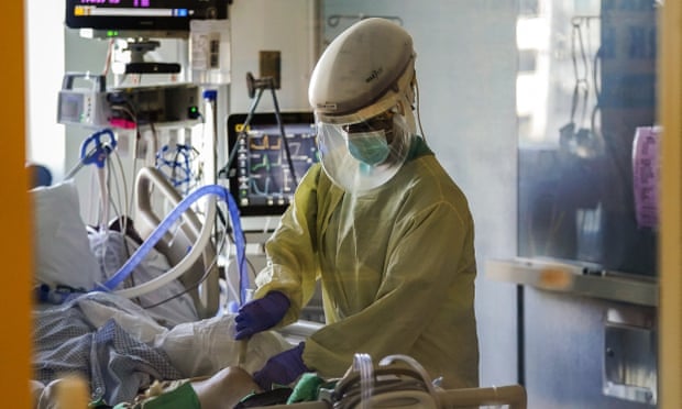 A healthcare worker tends to a Covid-19 patient in the intensive care unit at Santa Clara Valley medical center in San Jose, California.