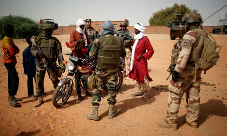 Malian and French soldiers patrol during anti-insurgent operations in Tin Hama, Mali, 19 October.
