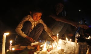 Candles are lit at a memorial for the victims of the 23 July blast in Kabul, Afghanistan.