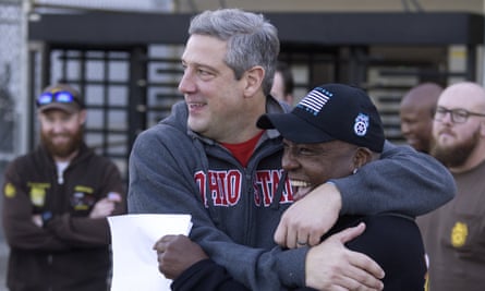 Tim Ryan, left, embraces Teamster local 413 member Dennis Harper outside a UPS facility in Columbus, Ohio, on 4 November 2022.