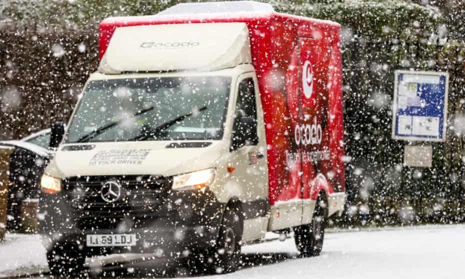 An Ocado delivery van as snows fall in north London