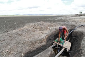 A man operates a water pump at the dry Cedro reservoir in Quixada, in the worst drought of the century.
