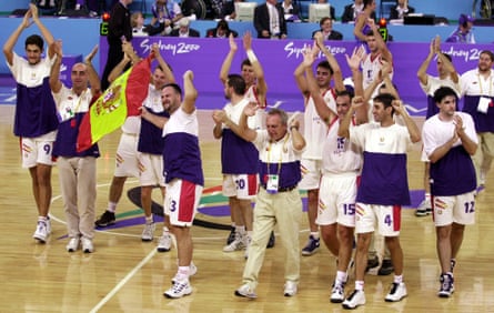 Players and coaching staff of the Spanish intellectual disability basketball team celebrate their victory over Russia in the final at the Paralympics in Sydney in October 2000
