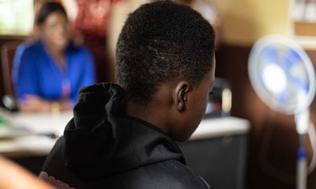 A rear view of a 17-year old boy at a rehab session at the City of Rest centre in Freetown, Sierra Leone.
