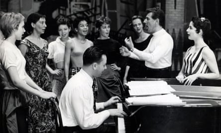 Stephen Sondheim at the piano and Leonard Bernstein rehearsing with Carol Lawrence, right, and the cast of West Side Story, 1957.
