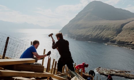 Maintenance crew volunteers erecting a fence in Eysturoy, Faroe Islands in April 2019. 