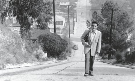 Art Pepper climbing the hill on Fargo Street in Los Angeles near his home.