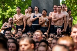 Annapolis, US Naval Academy plebes react after completing the Herndon Monument Climb in Maryland. The Climb is the traditional end to plebe year at the Naval Academy and the plebes must build a human pyramid to scale the monument, replacing the ‘Dixie cup’ hat with an upperclassman’s hat