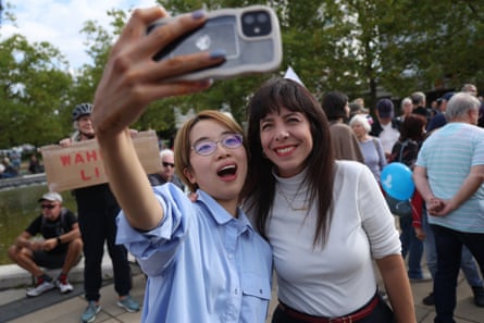 Eralp poses for a selfie with a supporter