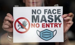 A shop window in Newport, Wales, last week, where people must wear face mask in shops and other indoor public spaces.