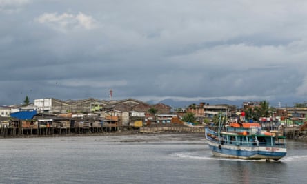 A boat loaded with supplies heads out to sea in Buenaventura, Colombia’s largest Pacific port and home to a small Muslim community.
