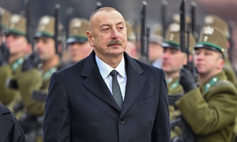 Ilham Aliyev and armed services personnel