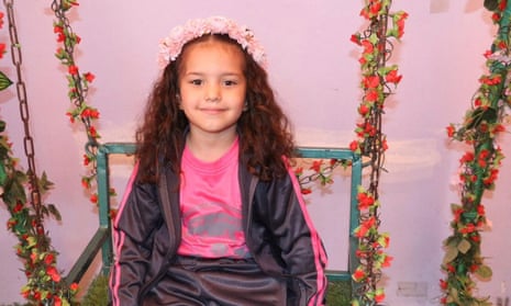 Hind Rajab, smiling and wearing a pink floral headband