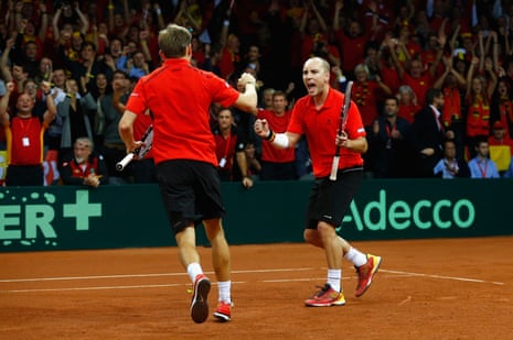 Steve Darcis and David Goffin celebrate winning the second set.